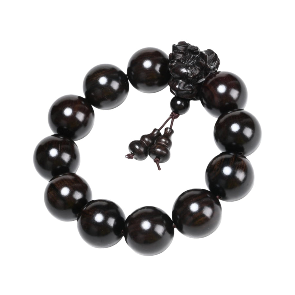 A 20-millimeter-diameter bracelet made of 12 hand-carved wooden beads, adorned with a carved dragon design