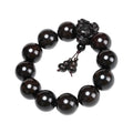 A 20-millimeter-diameter bracelet made of 12 hand-carved wooden beads, adorned with a carved dragon design