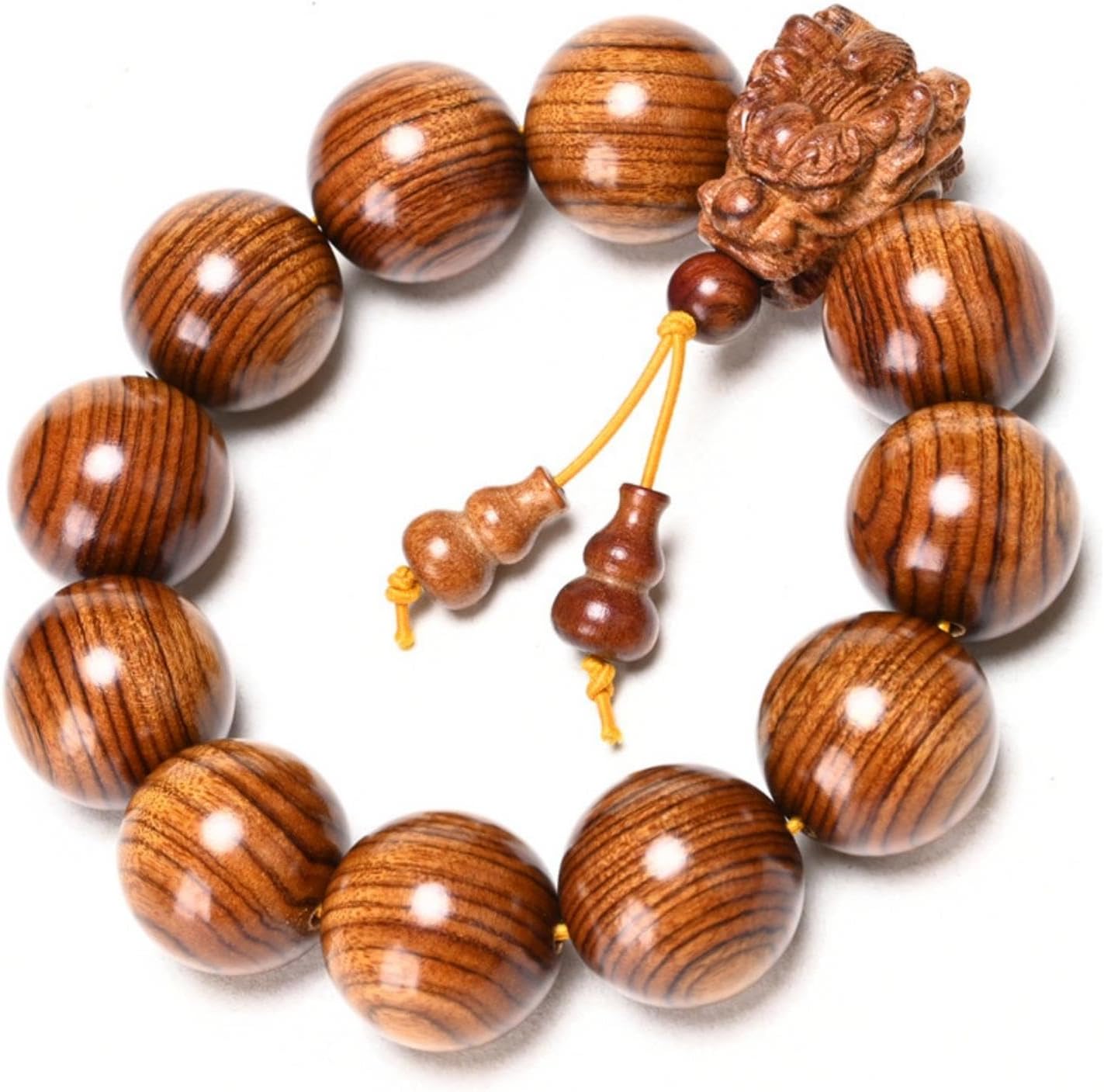 A 20-millimeter-diameter bracelet made of 12 hand-carved wooden beads, adorned with a carved dragon design