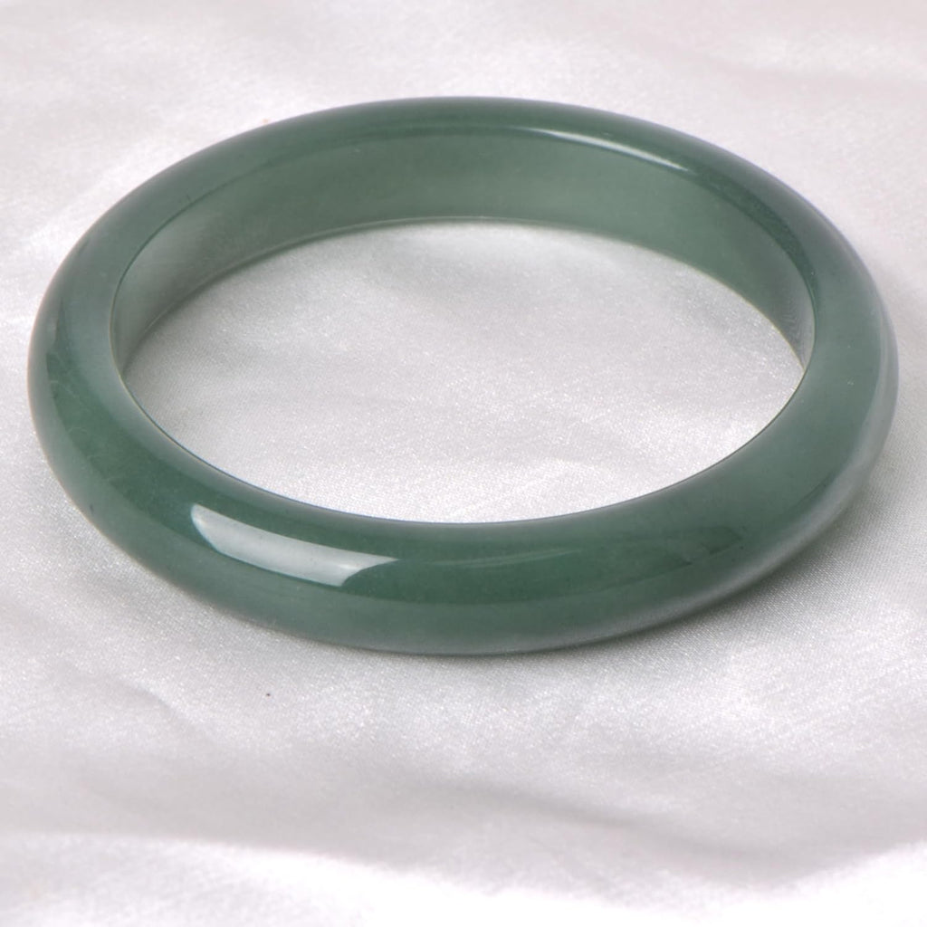 Green natural jade bracelet, known for its healing, protective, and wealth-attracting properties; natural gemstone feng shui jewelry