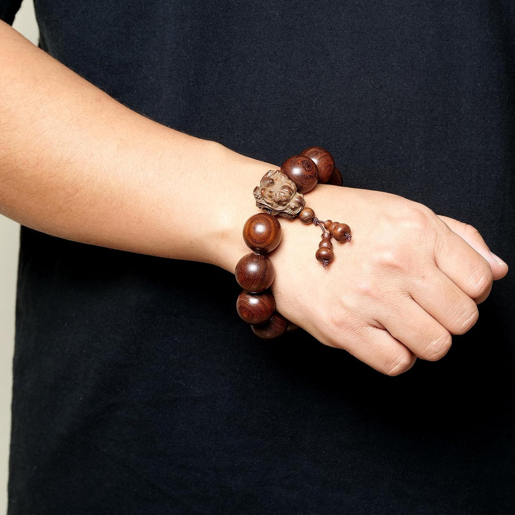 A 20-millimeter-diameter bracelet made of 12 hand-carved wooden beads, adorned with a carved dragon design